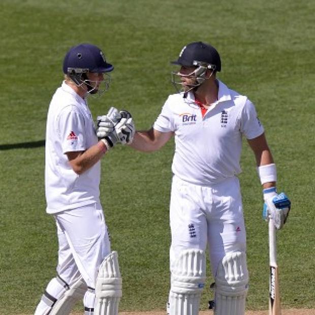 Matt Prior is congratulated by Joe Root after scoring 50 not out during day three of the Third Test match at Eden Park