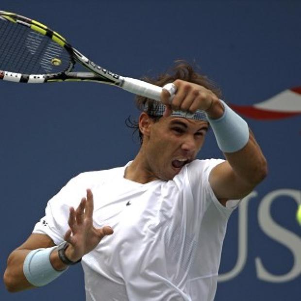 Rafael Nadal, pictured, eased to victory over Ryan Harrison (AP)