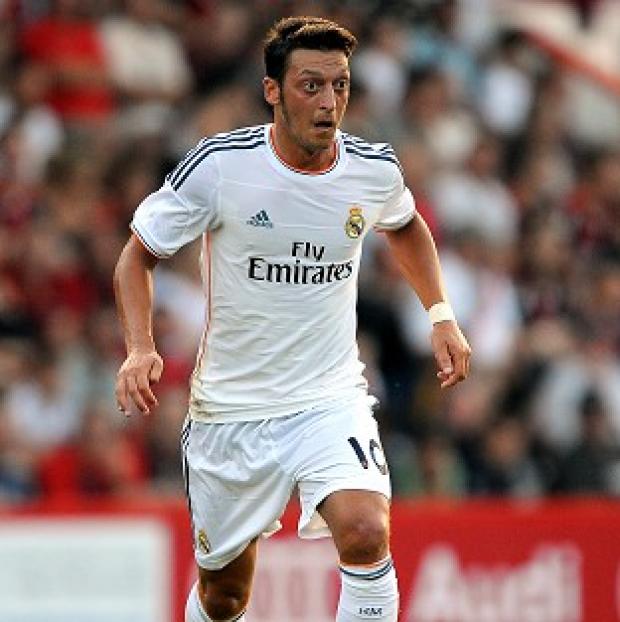 Joachim Low believes Mesut Ozil, pictured, will fit in well at Arsenal