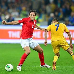 Frank Lampard, left, and Andriy Yarmolenko battle for the ball as England and Ukraine cancel each other out