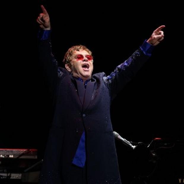 Elton John thinks fatherhood has calmed him down