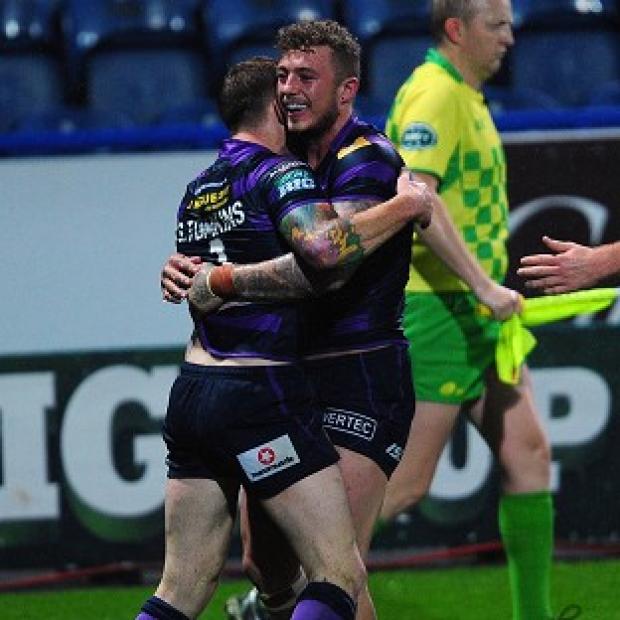 Josh Charnley, right, scored twice in Wigan's convincing win over Huddersfield
