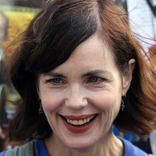 Elizabeth McGovern has said she would love to have the "grace and dignity" of her Downton Abbey character