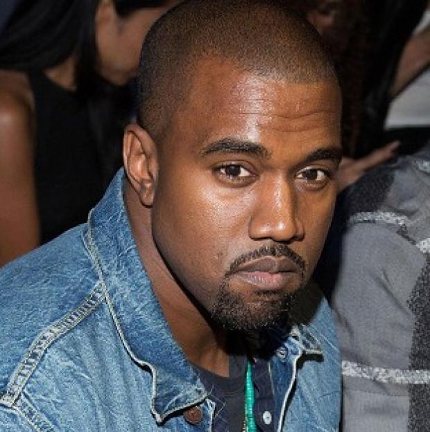 Kanye West had a scuffle with a celebrity photographer at Los Angeles International Airport (Dario Cantatore/Invision/AP, File)