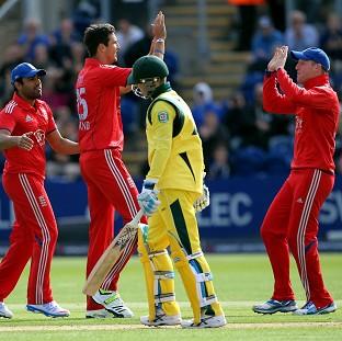 Steven Finn, centre, celebrates taking the wicket of Australia skipper Michael Clarke