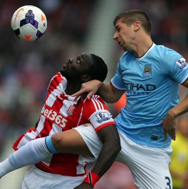 Congleton Guardian: Kenwyne Jones, left, jumps with Manchester City defender Matija Nastasic in a stalemate at the Britannia Stadium Congleton Guardian: Kenwyne Jones, left, jumps with Manchester City defender Matija Nastasic in a stalemate at the Britannia Stadium