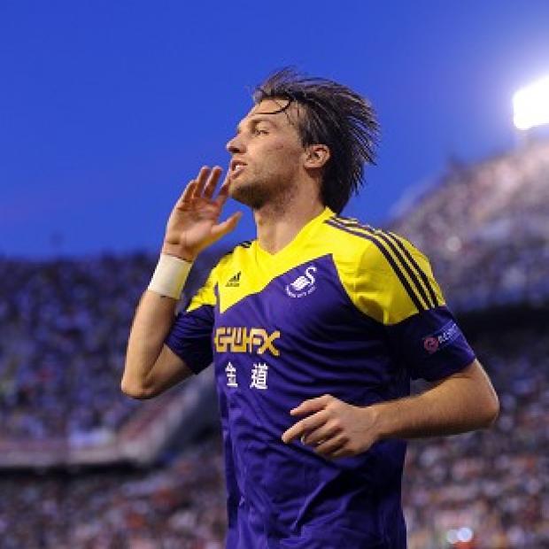 Michu celebrates his goal against Valencia