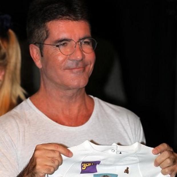 Simon Cowell won't be attending the birth of his baby