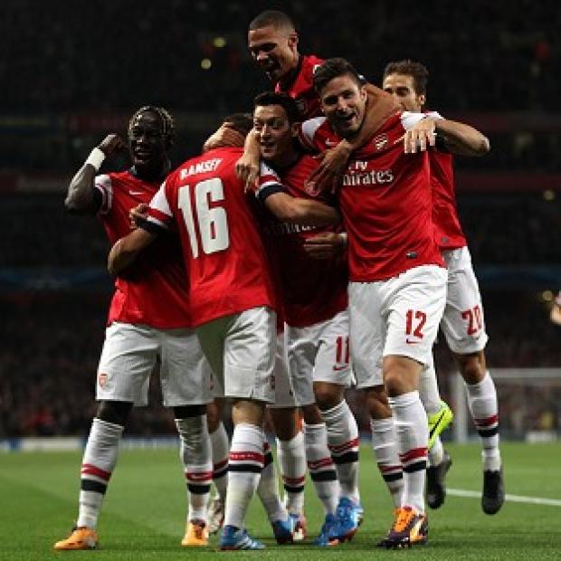 Mesut Ozil, centre, impressed in Arsenal's win over Napoli