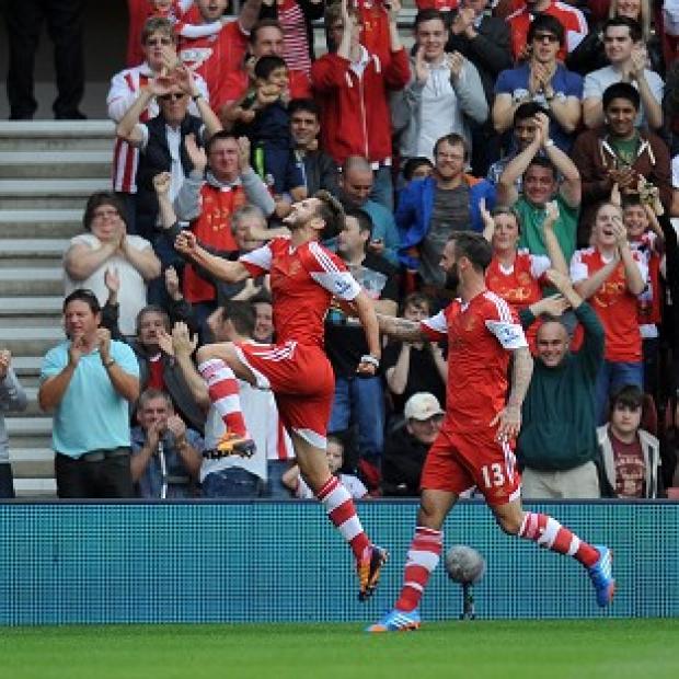 Adam Lallana, left, celebrates scoring Saints' opening goal