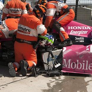Congleton Guardian: Safety team members work to remove Dario Franchitti from his car at the IndyCar Series Grand Prix of Houston (AP) Congleton Guardian: Safety team members work to remove Dario Franchitti from his car at the IndyCar Series Grand Prix of Houston (AP)