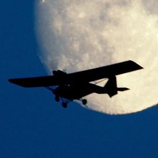 A passenger in a light aircraft had to land it with the help of two instructors from the ground