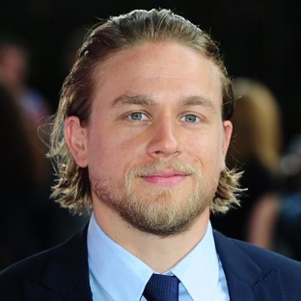Charlie Hunnam is set to play billionaire Christian Grey in the big-screen adaptation of saucy novel Fifty Shades Of Grey.