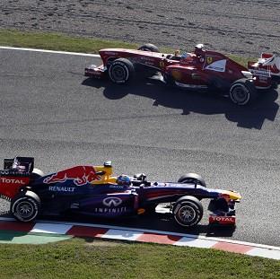 Sebastian Vettel, bottom, takes advantage of Fernando Alonso's, top, error (AP)