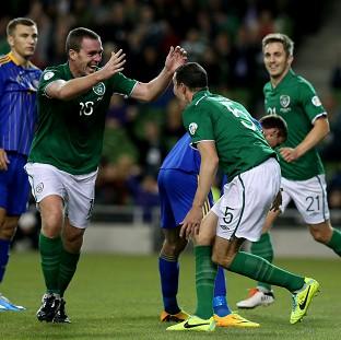 John O'Shea, second right, celebrates scoring for Ireland