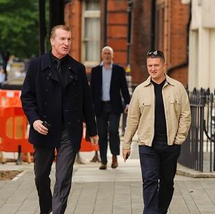 Kevin Carroll and Tommy Robinson deny obstructing police outside Aldgate East Tube station in east London on June 29