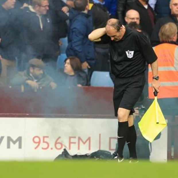 David Bryan was hit by a flare or smoke bomb during Aston Villa's match against Tottenham