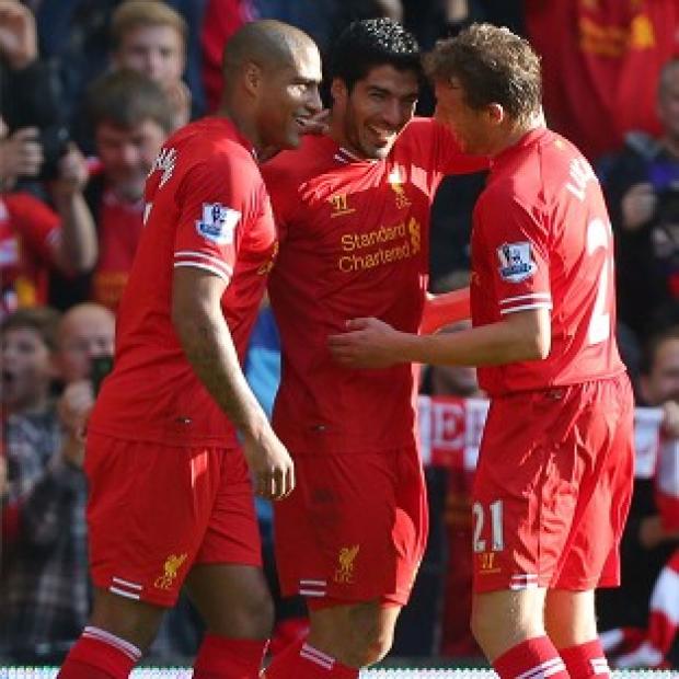 Congleton Guardian: Luis Suarez's, centre, hat-trick secured the victory Congleton Guardian: Luis Suarez's, centre, hat-trick secured the victory