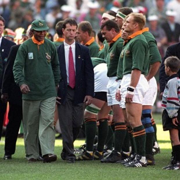 Congleton Guardian: Nelson Mandela walks towards Francois Pienaar before the 1995 World Cup final Congleton Guardian: Nelson Mandela walks towards Francois Pienaar before the 1995 World Cup final