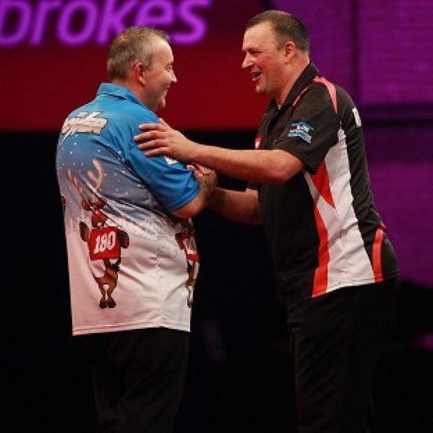 Congleton Guardian: Phil Taylor, left, overcame Rob Szabo 3-1 Congleton Guardian: Phil Taylor, left, overcame Rob Szabo 3-1