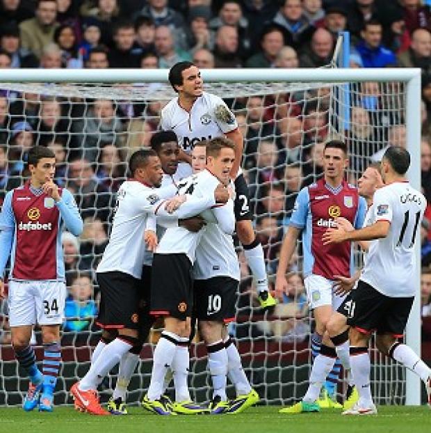 Congleton Guardian: Danny Welbeck, centre left, celebrates scoring the opening goal Congleton Guardian: Danny Welbeck, centre left, celebrates scoring the opening goal