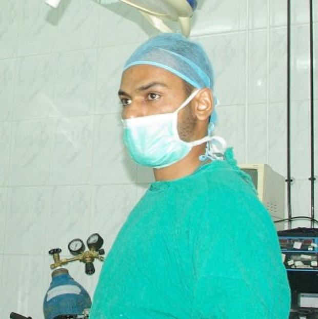 Congleton Guardian: Dr Abbas Khan in an operating theatre. Congleton Guardian: Dr Abbas Khan in an operating theatre.