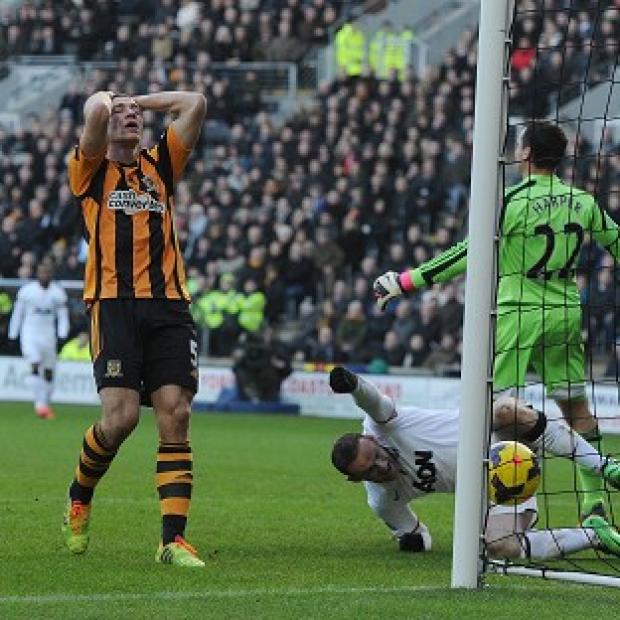 Congleton Guardian: James Chester holds his head after scoring an own goal Congleton Guardian: James Chester holds his head after scoring an own goal