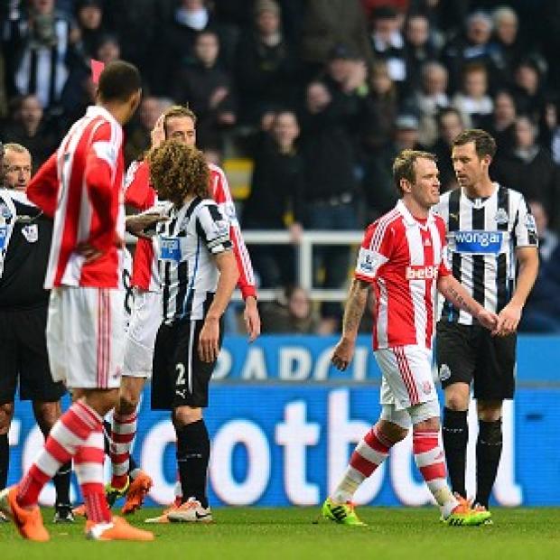 Congleton Guardian: Glenn Whelan, right, is shown a red card by referee Martin Atkinson, centre Congleton Guardian: Glenn Whelan, right, is shown a red card by referee Martin Atkinson, centre