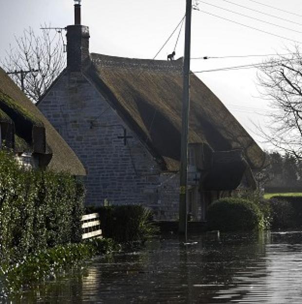 Congleton Guardian: Properties near the village of Muchelney, Somerset, where residents have been relying on volunteers in boats bringing in supplies Congleton Guardian: Properties near the village of Muchelney, Somerset, where residents have been relying on volunteers in boats bringing in supplies