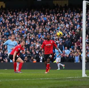 Congleton Guardian: Edin Dzeko, left, scored Manchester City's 100th goal of the season in the victory over Cardiff Congleton Guardian: Edin Dzeko, left, scored Manchester City's 100th goal of the season in the victory over Cardiff