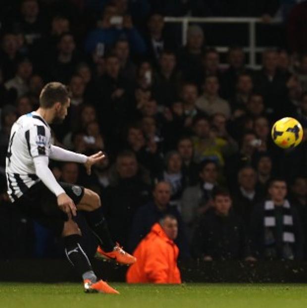 Congleton Guardian: Yohan Cabaye, left, curls in his second of the game to secure victory for Newcastle Congleton Guardian: Yohan Cabaye, left, curls in his second of the game to secure victory for Newcastle