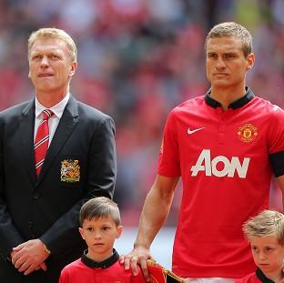 Congleton Guardian: David Moyes, left, reveals the decision for Nemanja Vidic, right, to leave the club was a mutual decision Congleton Guardian: David Moyes, left, reveals the decision for Nemanja Vidic, right, to leave the club was a mutual decision