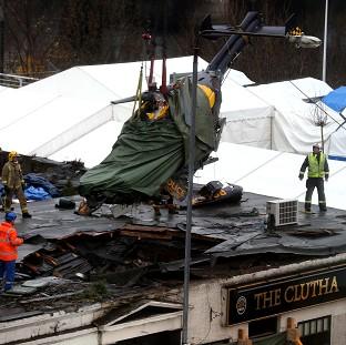 Congleton Guardian: The wreckage of the police Eurocopter is lifted from the Clutha Vaults in Glasgow following the crash Congleton Guardian: The wreckage of the police Eurocopter is lifted from the Clutha Vaults in Glasgow following the crash