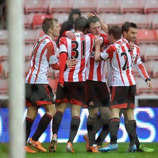Congleton Guardian: Craig Gardner, centre, is congratulated by his Sunderland team-mates after scoring Congleton Guardian: Craig Gardner, centre, is congratulated by his Sunderland team-mates after scoring