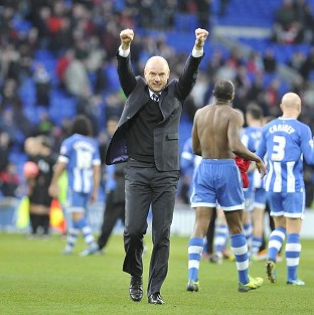 Congleton Guardian: Wigan boss Uwe Rosler celebrates at the final whistle Congleton Guardian: Wigan boss Uwe Rosler celebrates at the final whistle