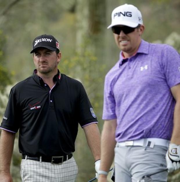 Congleton Guardian: Graeme McDowell, left, defeated Hunter Mahan on the third extra hole (AP) Congleton Guardian: Graeme McDowell, left, defeated Hunter Mahan on the third extra hole (AP)