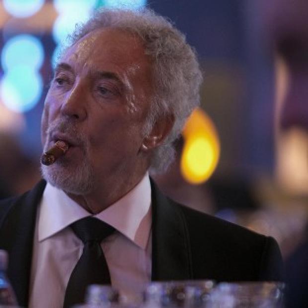 Congleton Guardian: Sir Tom Jones smokes a cigar during a gala dinner marking the end of the 16th annual Cigar Festival in Havana (AP) Congleton Guardian: Sir Tom Jones smokes a cigar during a gala dinner marking the end of the 16th annual Cigar Festival in Havana (AP)
