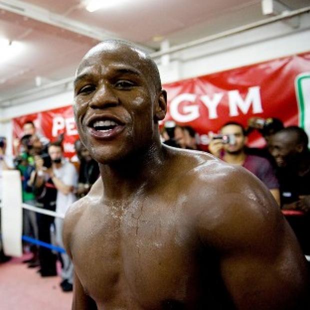Congleton Guardian: Floyd Mayweather, pictured, has set Amir Khan a challenge Congleton Guardian: Floyd Mayweather, pictured, has set Amir Khan a challenge