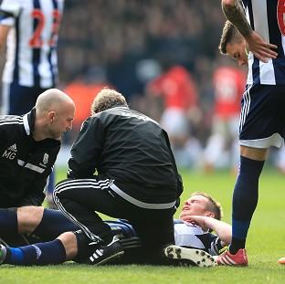 Congleton Guardian: Chris Brunt receives treatment during West Brom's match against Manchester United on Saturday Congleton Guardian: Chris Brunt receives treatment during West Brom's match against Manchester United on Saturday