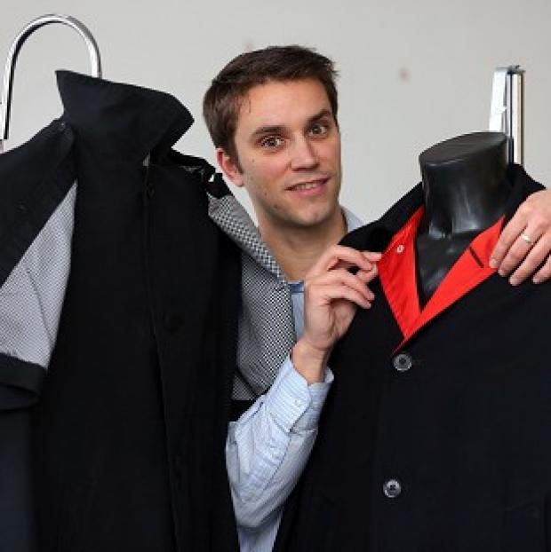 Congleton Guardian: Auctioneer Paul Fairweather with jackets worn by George Harrison (right) and Ringo Starr on the cover of the Beatles album Help! Congleton Guardian: Auctioneer Paul Fairweather with jackets worn by George Harrison (right) and Ringo Starr on the cover of the Beatles album Help!