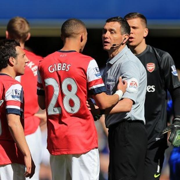Congleton Guardian: Kieran Gibbs appeals to referee Andre Marriner after his controversial red card Congleton Guardian: Kieran Gibbs appeals to referee Andre Marriner after his controversial red card