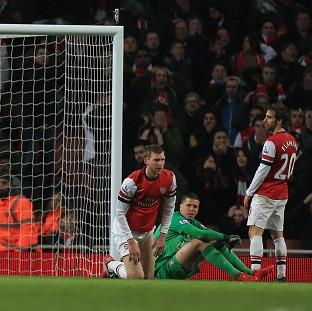 Congleton Guardian: Mathieu Flamini, right, scored the own goal which gave Swansea a point Congleton Guardian: Mathieu Flamini, right, scored the own goal which gave Swansea a point
