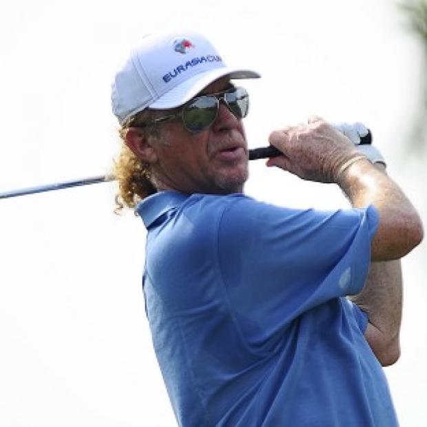 Congleton Guardian: Spain's Miguel Angel Jimenez watches the flight of his tee shot on the fifth hole during the first round of the Eurasia Cup golf tournament at the Glenmarie Golf and Country Club in Subang, Malaysia, Thursday, March 27, 2014. (AP Photo/Joshua Paul) Congleton Guardian: Spain's Miguel Angel Jimenez watches the flight of his tee shot on the fifth hole during the first round of the Eurasia Cup golf tournament at the Glenmarie Golf and Country Club in Subang, Malaysia, Thursday, March 27, 2014. (AP Photo/Joshua Paul)