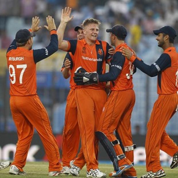Congleton Guardian: Timm van der Gugten, centre, celebrates with his team-mates after dismissing Eoin Morgan (AP) Congleton Guardian: Timm van der Gugten, centre, celebrates with his team-mates after dismissing Eoin Morgan (AP)