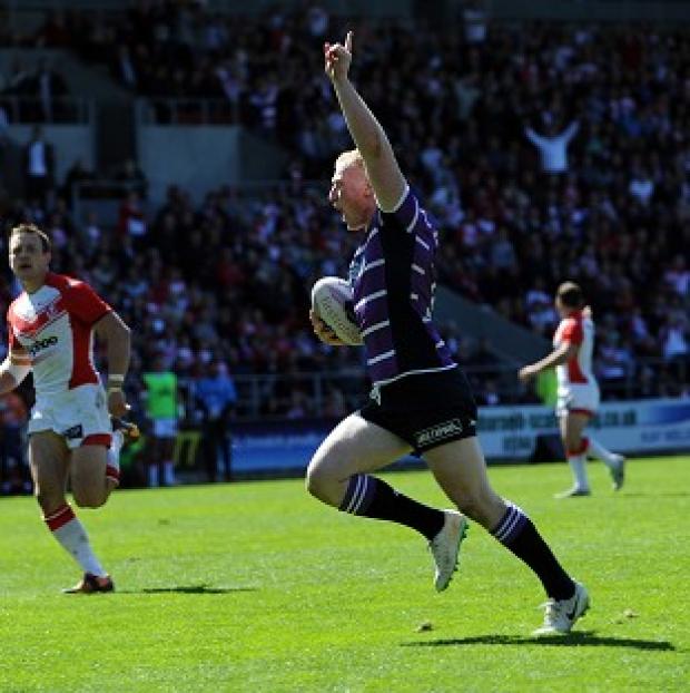 Congleton Guardian: Wigan Warriors' Liam Farrell celebrates as he runs over to score a try during the First Utility Super League match at Langtree Park, St Helens. Congleton Guardian: Wigan Warriors' Liam Farrell celebrates as he runs over to score a try during the First Utility Super League match at Langtree Park, St Helens.