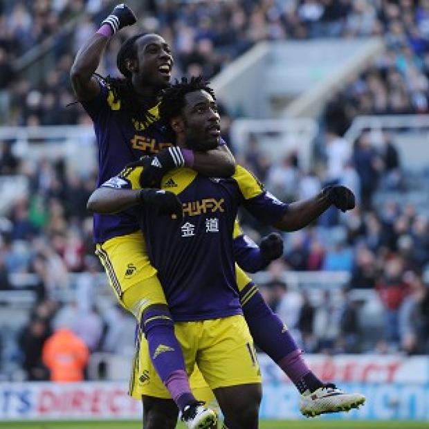 Congleton Guardian: Wilfried Bony, right, celebrates scoring the winner Congleton Guardian: Wilfried Bony, right, celebrates scoring the winner
