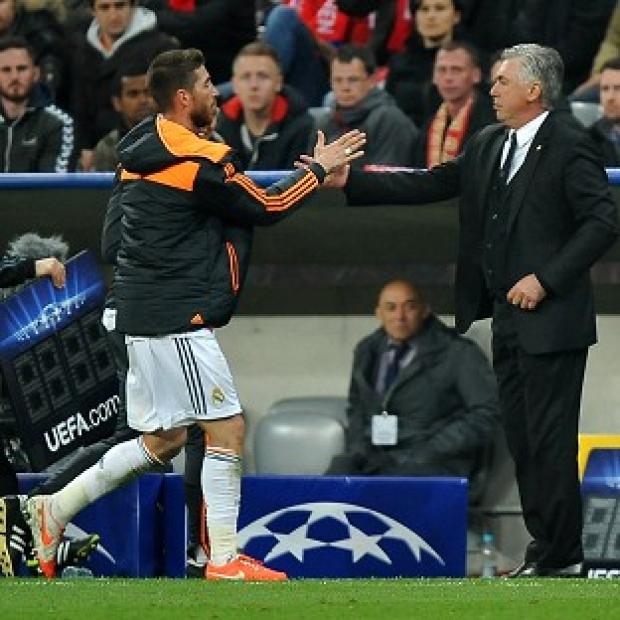 Congleton Guardian: Carlo Ancelotti, right, shakes hands with Sergio Ramos, who scored twice in Real's emphatic victory Congleton Guardian: Carlo Ancelotti, right, shakes hands with Sergio Ramos, who scored twice in Real's emphatic victory