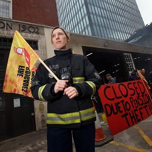 Congleton Guardian: Firefighter Jes Bate at Euston fire station in London as firefighters staged a five hour strike in a row over pensions Congleton Guardian: Firefighter Jes Bate at Euston fire station in London as firefighters staged a five hour strike in a row over pensions