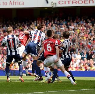 Congleton Guardian: Olivier Giroud, left, heads home the winner Congleton Guardian: Olivier Giroud, left, heads home the winner