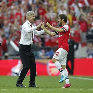 Congleton Guardian: Arsene Wenger, left, praised the spirit of his Arsenal side as they struck back to win the FA Cup Congleton Guardian: Arsene Wenger, left, praised the spirit of his Arsenal side as they struck back to win the FA Cup